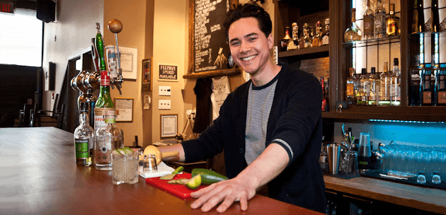 Friendly bartender using interpersonal customer service skills